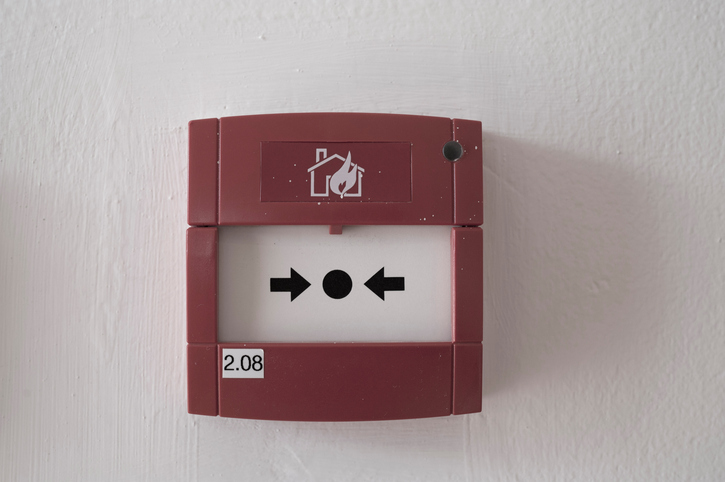 fire alarm box on cement wall for warning